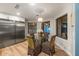 Bright kitchen eating area with stainless steel refrigerator and large picture windows at 8219 S Pecan Grove Cir, Tempe, AZ 85284