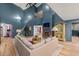 Expansive living room featuring high ceilings, a fireplace, and a comfortable sectional sofa at 8219 S Pecan Grove Cir, Tempe, AZ 85284