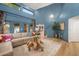 This open-concept living room features high ceilings, hardwood floors, and stylish modern decor at 8219 S Pecan Grove Cir, Tempe, AZ 85284