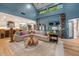 Spacious living room with a large sectional sofa, open to the kitchen, filled with natural light at 8219 S Pecan Grove Cir, Tempe, AZ 85284