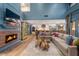 Inviting living room with a cozy fireplace, large sectional, and an open-concept design at 8219 S Pecan Grove Cir, Tempe, AZ 85284