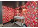 Bold powder room with eye-catching wallpaper, modern fixtures, and stylish design at 8219 S Pecan Grove Cir, Tempe, AZ 85284