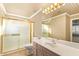 Bright bathroom with a tub/shower combo and a neutral-toned vanity at 8402 W Rosemonte Dr, Peoria, AZ 85382