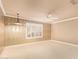 Bedroom featuring carpet, ceiling fan, geometric wallpaper and shuttered windows at 8402 W Rosemonte Dr, Peoria, AZ 85382