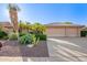Beautiful home with desert landscaping, mature palm trees, and a three-car garage at 8402 W Rosemonte Dr, Peoria, AZ 85382