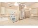 Functional kitchen with tiled counters, white appliances, and a cozy breakfast nook at 8402 W Rosemonte Dr, Peoria, AZ 85382