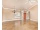 Large living room featuring tiled floors, plantation shutters, and a decorative chandelier at 8402 W Rosemonte Dr, Peoria, AZ 85382