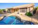 An inviting pool with a view of the home, patio, and yard at 8402 W Rosemonte Dr, Peoria, AZ 85382