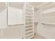 Bright, organized walk-in closet with adjustable shelving for optimal storage at 8402 W Rosemonte Dr, Peoria, AZ 85382