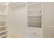 Bright, organized walk-in closet with rods, shelving, and drawers at 8402 W Rosemonte Dr, Peoria, AZ 85382