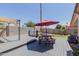 Relaxing backyard includes a hot tub, picnic table with umbrella, firepit and plenty of room to entertain at 8622 W Shaw Butte Dr, Peoria, AZ 85345