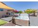 This backyard has a hot tub with a sunshade, a picnic table, and an umbrella at 8622 W Shaw Butte Dr, Peoria, AZ 85345