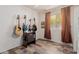 This bedroom features a hardwood floor, many guitars, and a view outside at 8622 W Shaw Butte Dr, Peoria, AZ 85345