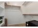 Walk-in closet featuring built-in shelving and ample storage space at 8622 W Shaw Butte Dr, Peoria, AZ 85345