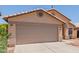 Inviting home exterior featuring a well-manicured lawn, desert landscaping, and a spacious two-car garage at 8622 W Shaw Butte Dr, Peoria, AZ 85345
