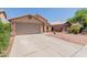 Charming single-story home with desert landscaping, two-car garage and covered entryway at 8622 W Shaw Butte Dr, Peoria, AZ 85345
