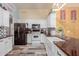 Bright kitchen featuring a farmhouse sink, black appliances and butcher block countertops at 8622 W Shaw Butte Dr, Peoria, AZ 85345