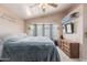 Bright main bedroom featuring a vaulted ceiling and a large window with lots of natural light at 8622 W Shaw Butte Dr, Peoria, AZ 85345