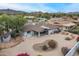 Aerial view of home with a covered patio, gravel yard, unique landscaping, and mountain views at 9039 N Concho Ln, Phoenix, AZ 85028