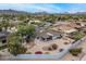Aerial view showcasing the home's landscaped yard, and neighboring houses at 9039 N Concho Ln, Phoenix, AZ 85028