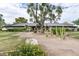 A sprawling home with a covered entry, mature landscaping, and brick walkway at 9039 N Concho Ln, Phoenix, AZ 85028