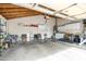 Spacious garage with overhead storage, laundry area and bright lighting at 9039 N Concho Ln, Phoenix, AZ 85028