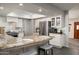 Bright, open kitchen featuring granite countertops, stainless steel appliances, and white cabinetry at 9039 N Concho Ln, Phoenix, AZ 85028
