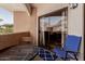 Relax on the balcony with comfortable seating and enjoy seamless indoor-outdoor living at 10030 W Indian School Rd # 215, Phoenix, AZ 85037