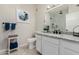 Bathroom featuring granite countertops, white cabinets, and glass-enclosed shower at 10030 W Indian School Rd # 215, Phoenix, AZ 85037