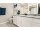 Stylish bathroom featuring white cabinetry, granite countertops, and modern fixtures at 10030 W Indian School Rd # 215, Phoenix, AZ 85037