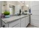 Bathroom featuring granite countertops, white cabinets, and modern fixtures at 10030 W Indian School Rd # 215, Phoenix, AZ 85037