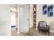 Open walk-in closet with shelves, hanging rods, and carpet floors at 10030 W Indian School Rd # 215, Phoenix, AZ 85037