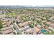 Large neighborhood aerial showcasing two-story homes with desert landscaping, tree lined streets, mountain views in distance at 11158 N 162Nd Dr, Surprise, AZ 85379