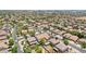 Expansive aerial view of a residential neighborhood showcasing well-maintained homes and tree-lined streets in a peaceful community at 11158 N 162Nd Dr, Surprise, AZ 85379