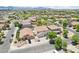 Aerial view of a residential neighborhood features a well-kept two-story home and lush landscaping at 11158 N 162Nd Dr, Surprise, AZ 85379