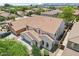 Aerial view showcases a two-story home with terracotta roof and desert landscaping in a well-planned community at 11158 N 162Nd Dr, Surprise, AZ 85379