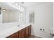 Bright bathroom featuring a sink with a wide mirror and cabinet storage underneath at 11158 N 162Nd Dr, Surprise, AZ 85379