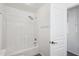 Clean white bathroom with a shower and tub combination and a shower head at 11158 N 162Nd Dr, Surprise, AZ 85379