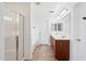 Bright bathroom featuring double sinks, a walk-in shower, and a soaking tub at 11158 N 162Nd Dr, Surprise, AZ 85379