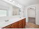 Bathroom featuring double sinks, large mirror, and tile flooring at 11158 N 162Nd Dr, Surprise, AZ 85379