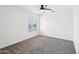 Cozy bedroom features neutral walls, carpet floors, and a window letting in natural light at 11158 N 162Nd Dr, Surprise, AZ 85379