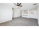 Bright bonus room features a ceiling fan, neutral walls and plush carpet floors at 11158 N 162Nd Dr, Surprise, AZ 85379