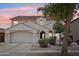 Charming two-story home with a well-maintained front yard, a neutral color scheme, and a terracotta tile roof at 11158 N 162Nd Dr, Surprise, AZ 85379