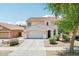 Charming two-story home featuring a three-car garage and well-maintained landscaping at 11158 N 162Nd Dr, Surprise, AZ 85379