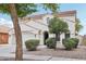 Stunning two-story home with an attached garage, an arched entryway, and professionally landscaped front yard at 11158 N 162Nd Dr, Surprise, AZ 85379