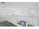 An airy foyer with hardwood floors below and carpeted stairs leading up at 11158 N 162Nd Dr, Surprise, AZ 85379