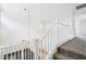 Light and bright foyer with railing overlooking the living area and dark hardwood floors at 11158 N 162Nd Dr, Surprise, AZ 85379