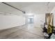Spacious and clean garage interior, offering ample room for parking and storage with its well-lit and functional design at 11158 N 162Nd Dr, Surprise, AZ 85379