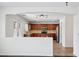 Kitchen with stainless appliances, wood cabinets, and breakfast bar seen from living room at 11158 N 162Nd Dr, Surprise, AZ 85379