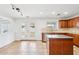 Kitchen island in bright kitchen with stainless steel appliances and a double glass door at 11158 N 162Nd Dr, Surprise, AZ 85379